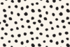 Off white and black polka dot seamless pattern featuring organic hand-drawn dots for fashion, textile printing, accessories, and surface design.